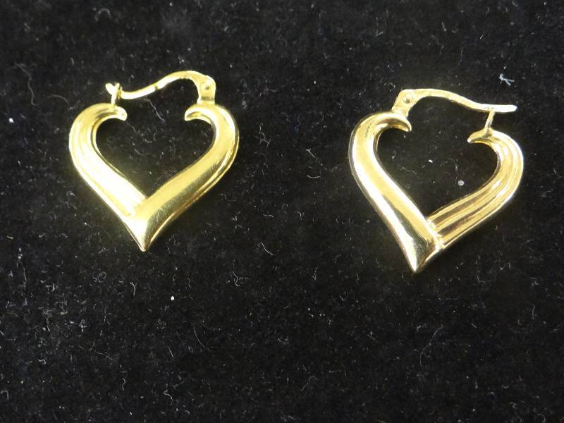 lot 1151 image: 14K gold heart hoop earrings.