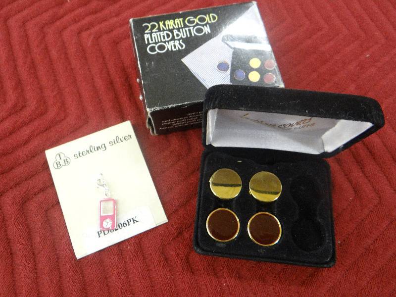 lot 1156 image: 2 Sets of 22K gold plated button covers & sterling silver Ipod charm.