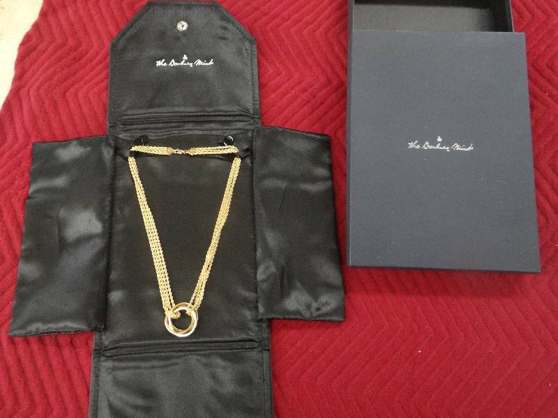 lot 1159 image: Golden trinity necklace w14K gold plated hoops & woven rope chain. comes wtravel case & box.