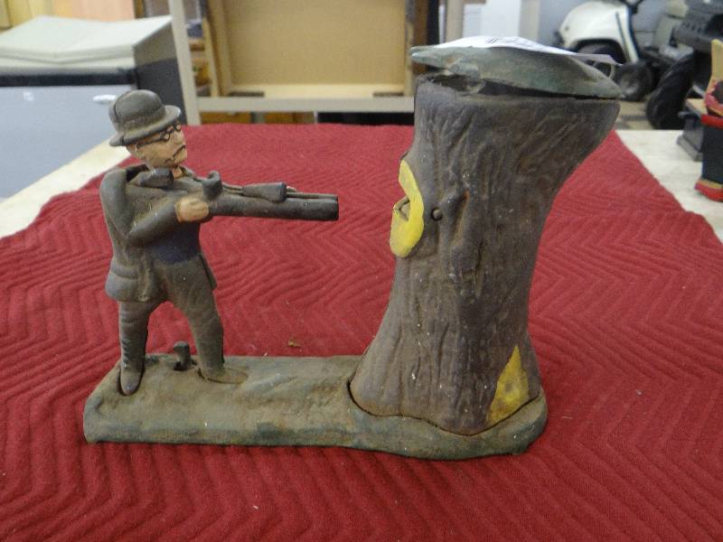 lot 1188 image: Vintage painted iron Bear hunt bank - spring action.