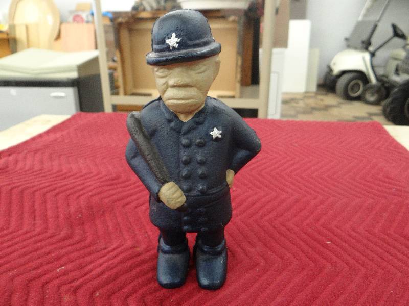 lot 1191 image: Painted iron policeman bank.