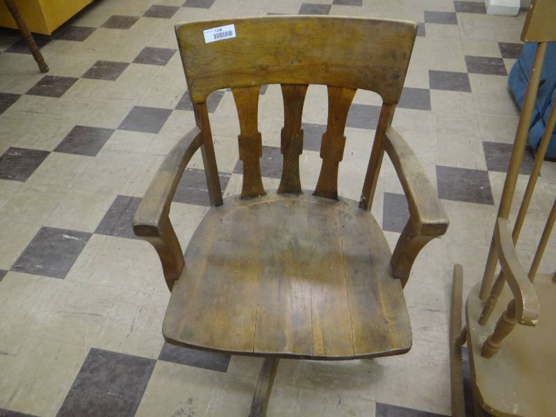 lot 1208 image: Vintage wood swivel office chair on casters.