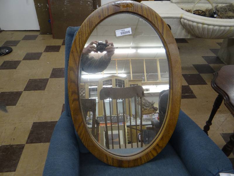 lot 1226 image: Oval Oak framed mirror.