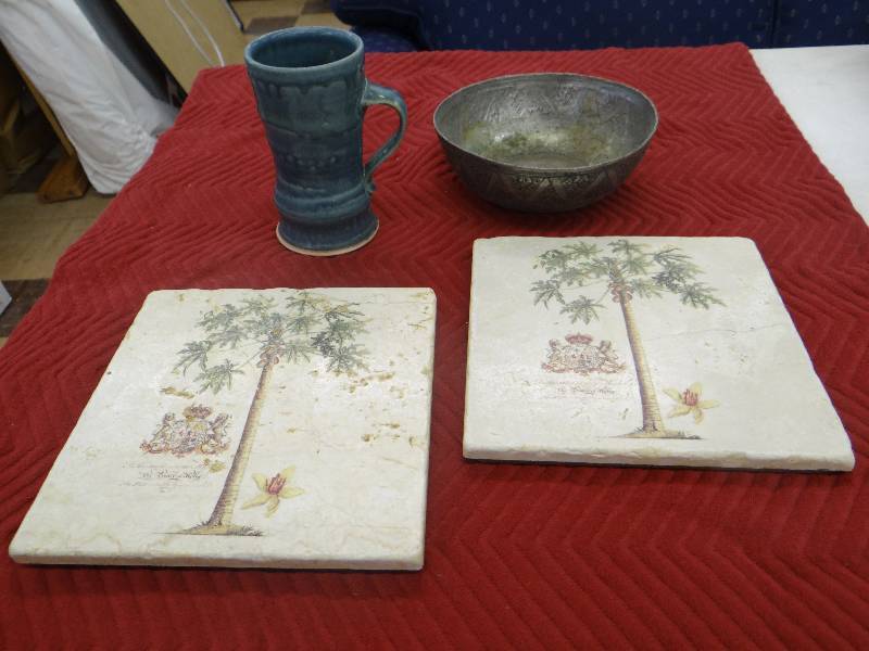 lot 1264 image: Lot of decor, palm tree wall tiles, heavy metal bowl, pottery mugvase.
