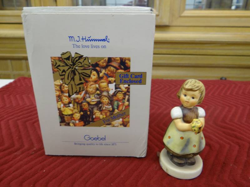 lot 1301 image: GoebelM.I. hummel for mother figurine wbox & paper.