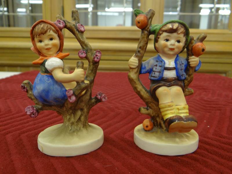 lot 1309 image: GoebelM.I. hummel - set of 2, apple tree girl & apple tree boy figurines.