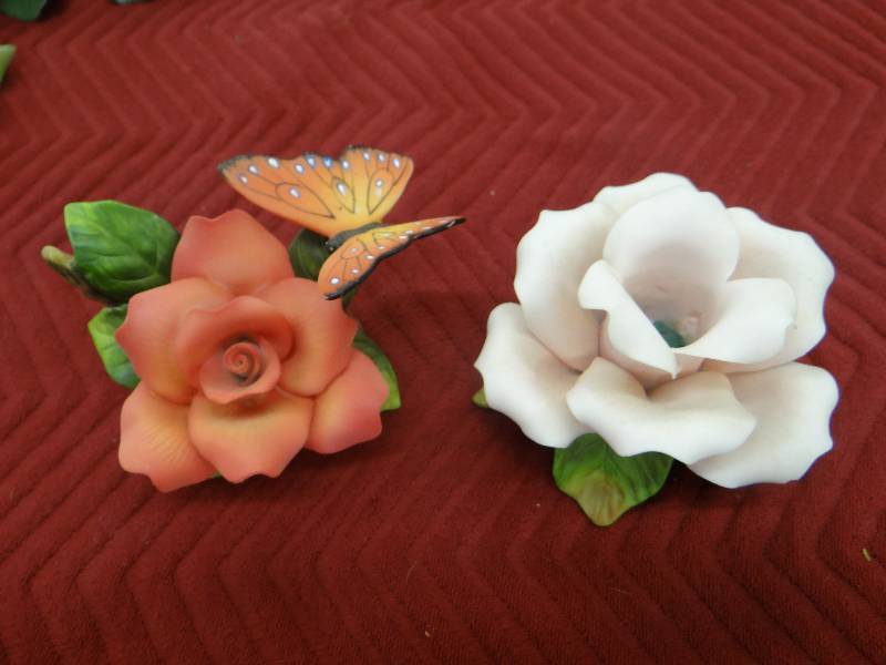 lot 1334 image: Lot of 2 porcelain roses, 1 wbutterfly - 1 is a taper holder.