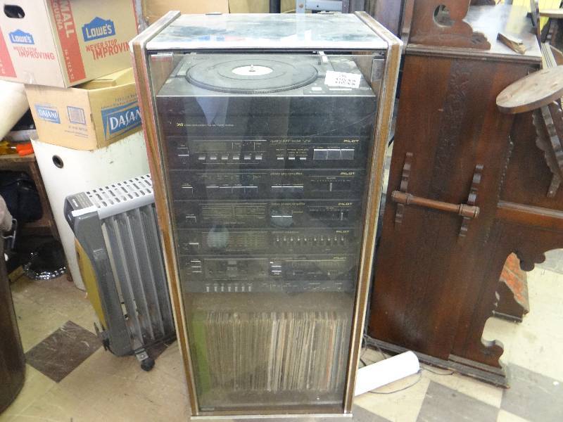 lot 1368 image: Full pilot soundstereo system wturn table - in glass front rolling cabinet - including all albums.