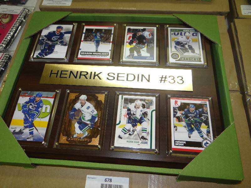 lot 678 image: #33 Henrik Sedin 8 card wall display.