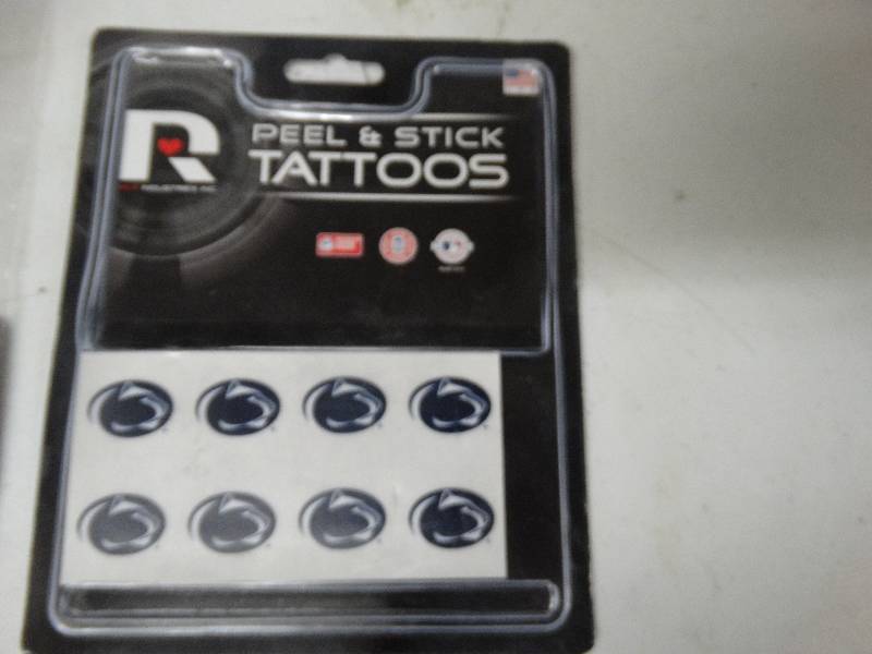 lot 714 image: Pen state lions face tats.