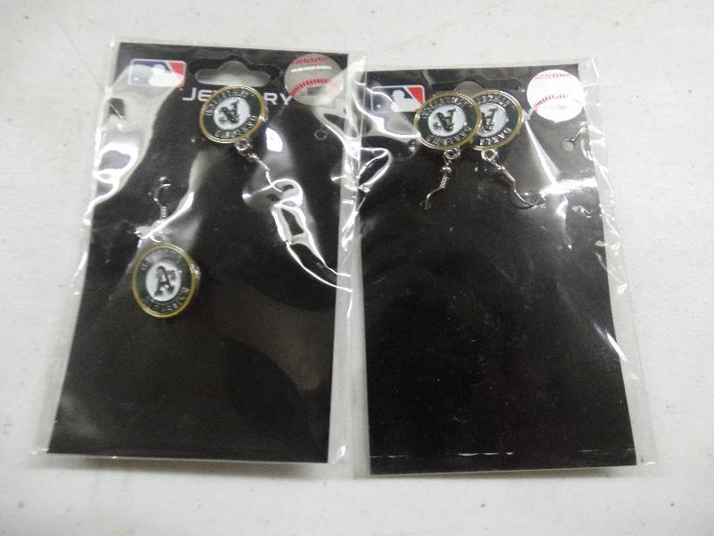 lot 730 image: 2 Pair Oakland As earrings.