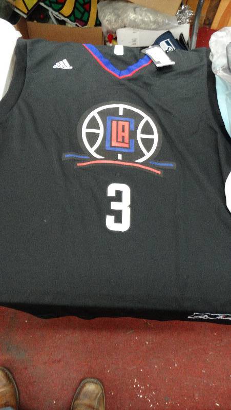 lot 791 image: New X-large clippers replica jersey.