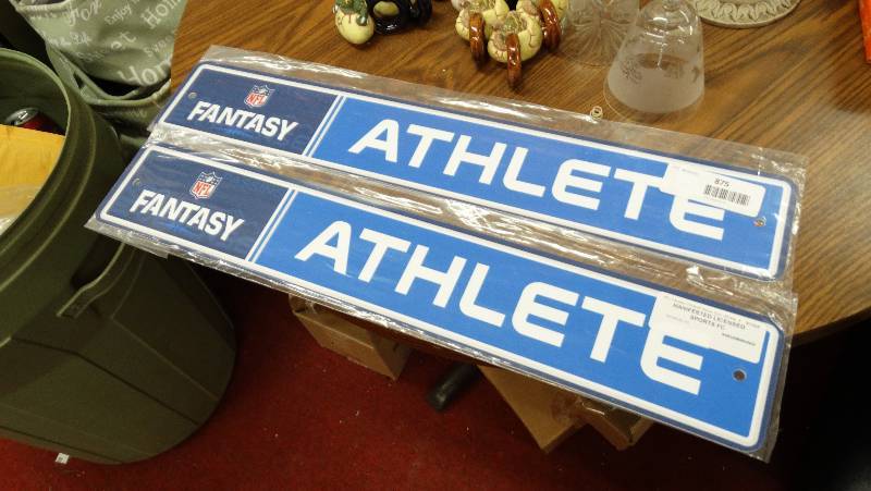 lot 875 image: 2 Fantasy Athlete wall sign.