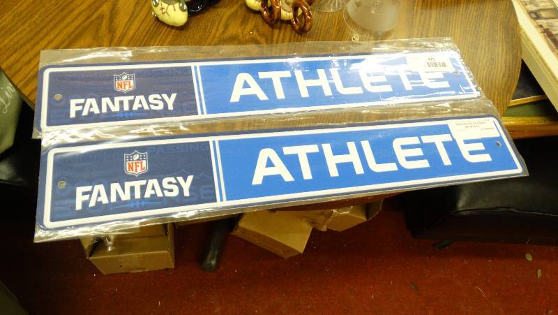 lot 876 image: 2 Fantasy Athlete wall sign.