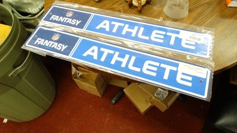lot 877 image: 2 Fantasy Athlete wall sign.