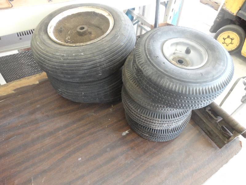 lot 1909 image: Lot of dollywagon wheels.