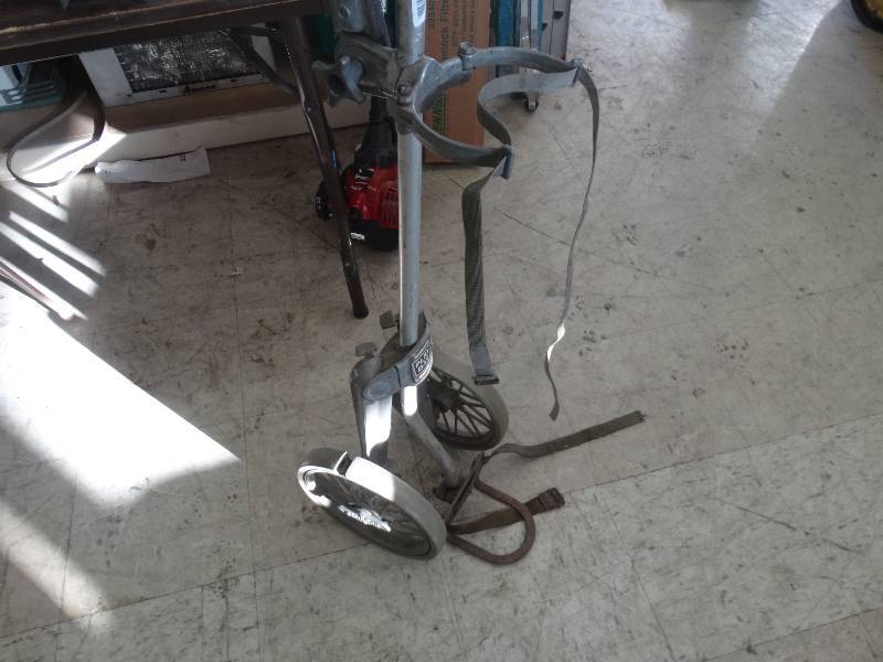 lot 1911 image: Old golf caddy.