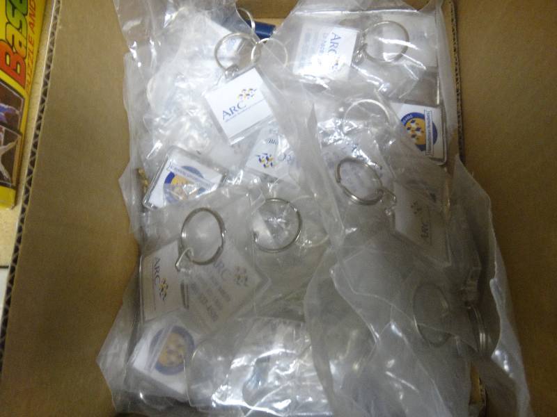 lot 1965 image: Box of key chains.