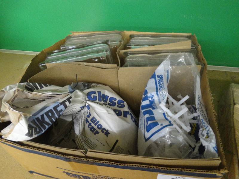 lot 1976 image: Mortar, spacers, & 4 pc glass block.