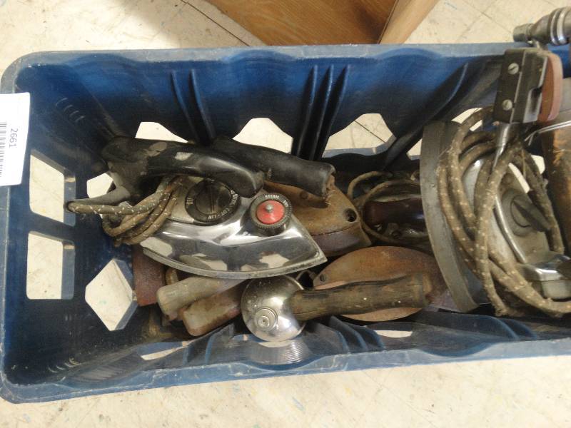 lot 2661 image: Tote of old irons, tote included.