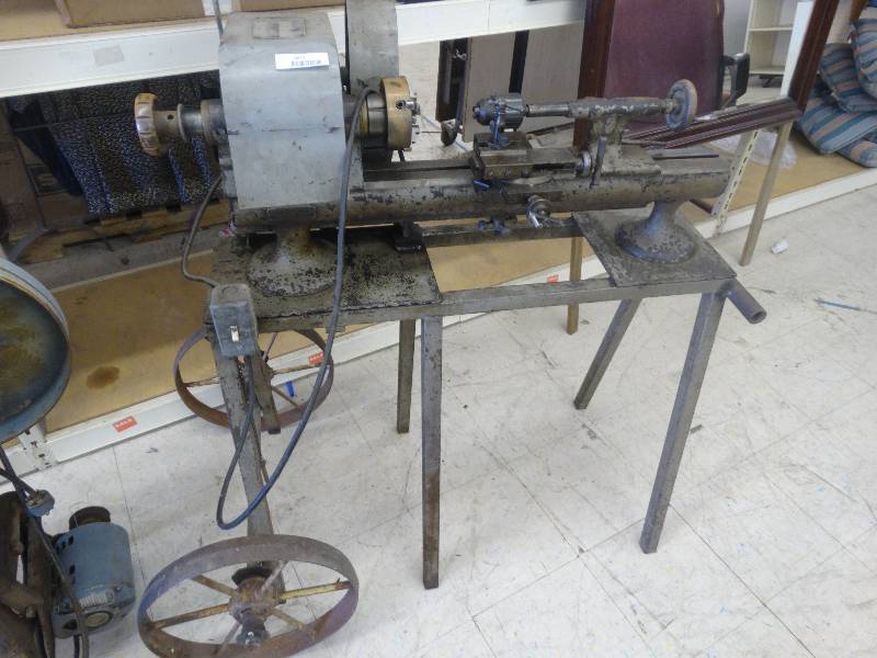 lot 2671 image: Sideways drill press on wheels.