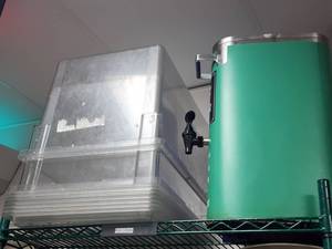 lot 10838 image: 2 Large Lexan Food Storage Containers with Lids and Tea Dispenser&nbsp