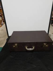 lot 2331 image: old leather looking suitcase wkey