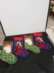lot 2615 image: lit of 4 cross stitched stockings