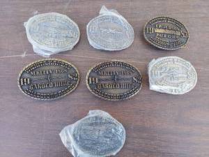 lot 5663 image: 7 belt buckles- Barbed Wire association