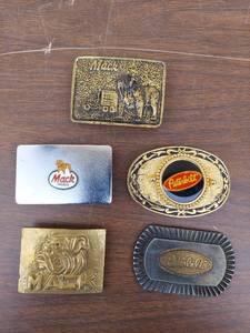 lot 5719 image: belt buckles- Mack and Peterbilt