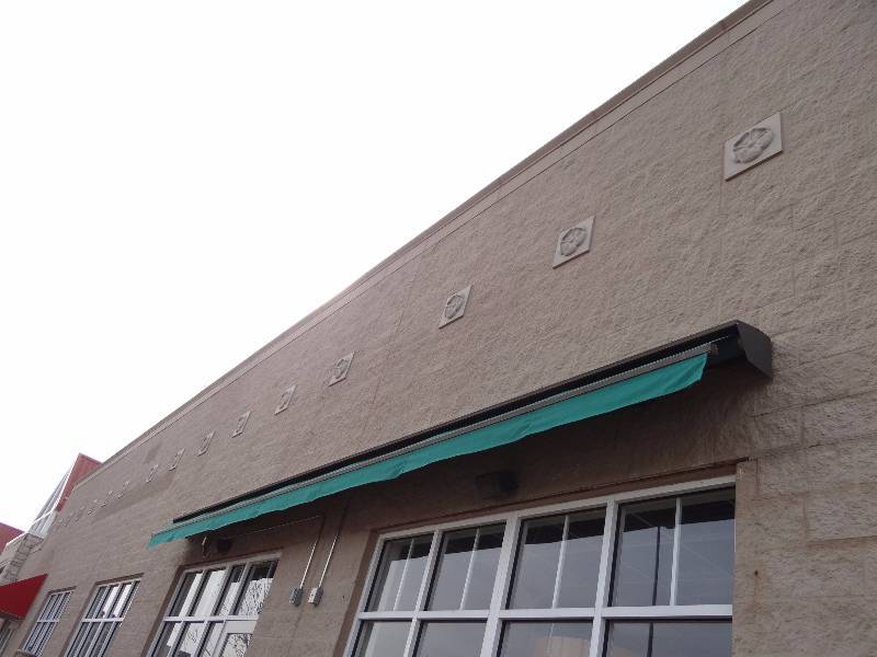 lot 2693 image: 355 Electric Awning With Green Canvas