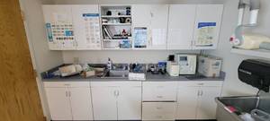 lot 5917 image: Gray  White Bottom and Upper Cabinetry W Veterinary Medical Supplies