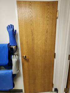 lot 37417 image: Wood Door With Gold Lever