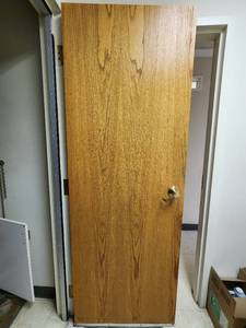 lot 37418 image: Wood Door With Gold Lever