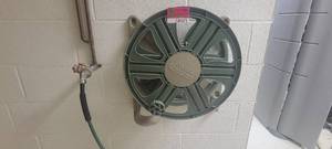 lot 49475 image: Ames Reel Easy Hose Reel W a Green Coiled Hosing