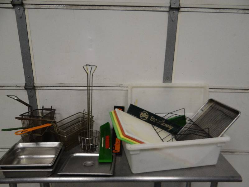 lot 747 image: Large Assorted Lot of Poly Cutting Boards Fryer Baskets And More