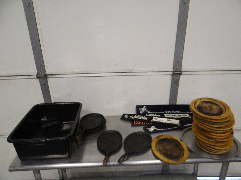 lot 748 image: Large Assorted Lot of Oval Cast iron Serving Dishes w Wood Hot Food Serving Dishes