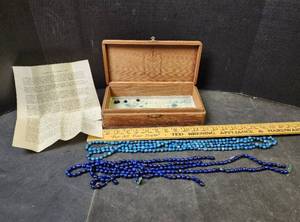 lot 102 image: Wooden Box with Vintage Voo-Doo Beads
