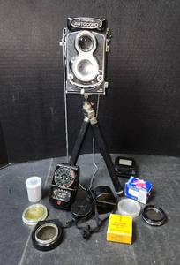 lot 166 image: Vintage Minolta Autocord Camera and Accessories, Tripod, Light Meter, Film, and Multiple Camera Lenses