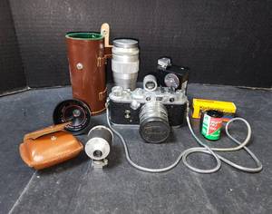 lot 167 image: Vintage Nikor Camera, Light Meter, Film, and Multiple Camera Lenses