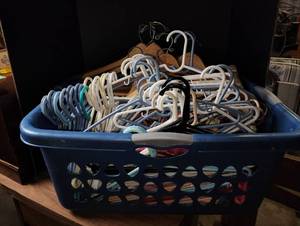 lot 438 image: Basket Full of Plastic and Wooden Hangers