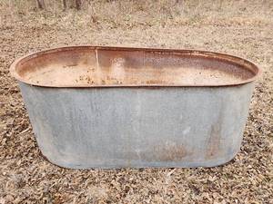 lot 514 image: Galvanized Stock Tank (see pics for small holes) 61x32x23