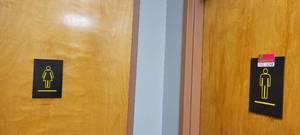 lot 18248 image: Men and Women Bathroom Signs, Black and Yellow