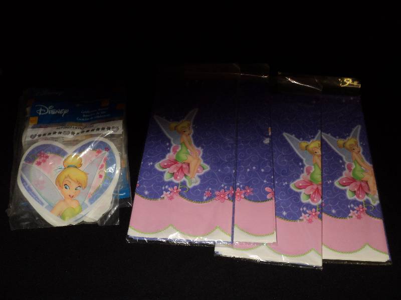 lot 4029 image: Mixed lot of Tinkerbell plastic party banners and table cloths, (4) Table cloths, (7) plastic banners