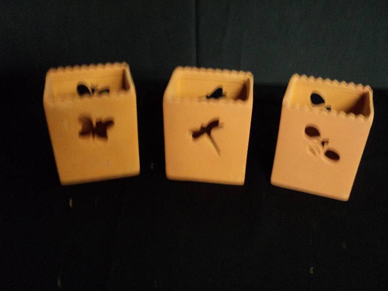 lot 4034 image: (3) ct. lot Terra Cotta Candle Holder Bag shape w bug cut-outs, perfect for the patio