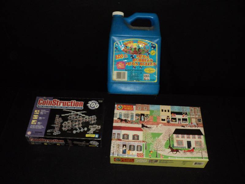 lot 4085 image: Mixed lot games and activities (1) Coinstruction, (1) 500 piece puzzle, (1) partial jug Mega Bubbles