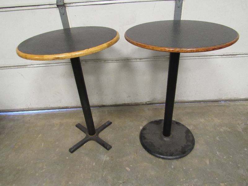 lot 1026 image: Pair Of 30 Bar Height Tables On Heavy Cast Bases