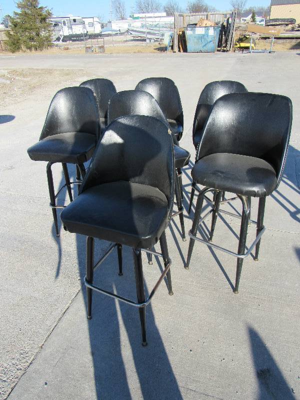 lot 1075 image: (7) Black Vinyl Padded Swiveling Bar Height Chairs