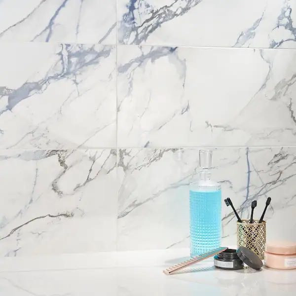 lot 66884 image: Ivy Hill Tile Calacatta Indigo 12 in. x 24 in. Polished Porcelain Floor and Wall Tile (6-Piece, 11.62 sq. ft.Case) (Set of 2 Cases) -Retail $85.49