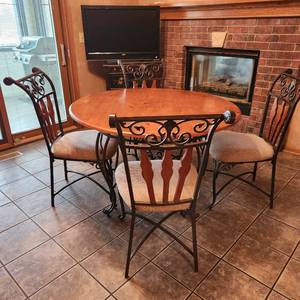 lot 1000 image: Ashley Furniture metal and wood table and 4 chairs 30 x 47 dia